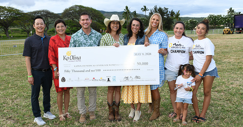 Group shot with giant check for $50,000.