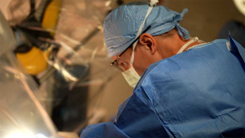 Physician in operating room.