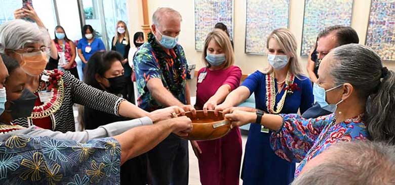 Cancer Center employees and HPH leaders join in blessing the Cancer Center at Pali Momi.