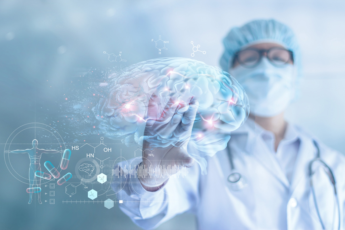 a doctor dressed in scrubs looks at a digital image of a brain with hot spots where neurons are firing