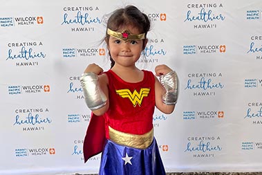 Girl dressed up as Wonder Woman for Halloween.