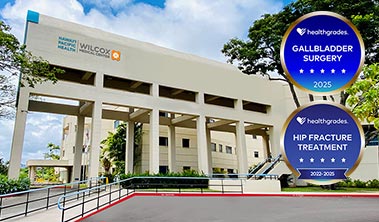 Healthgrades medallions for various distinctions in specialty care alongside Wilcox Medical Center exterior.