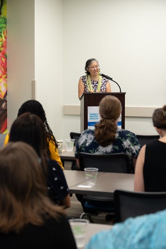 Dina Shek, legal director of the MLPC program in Hawaii and faculty specialist at the UH School of Law, addresses the crowd during an event held in November 2024 celebrating the launch of the pilot program at Kapiolani Medical Center.