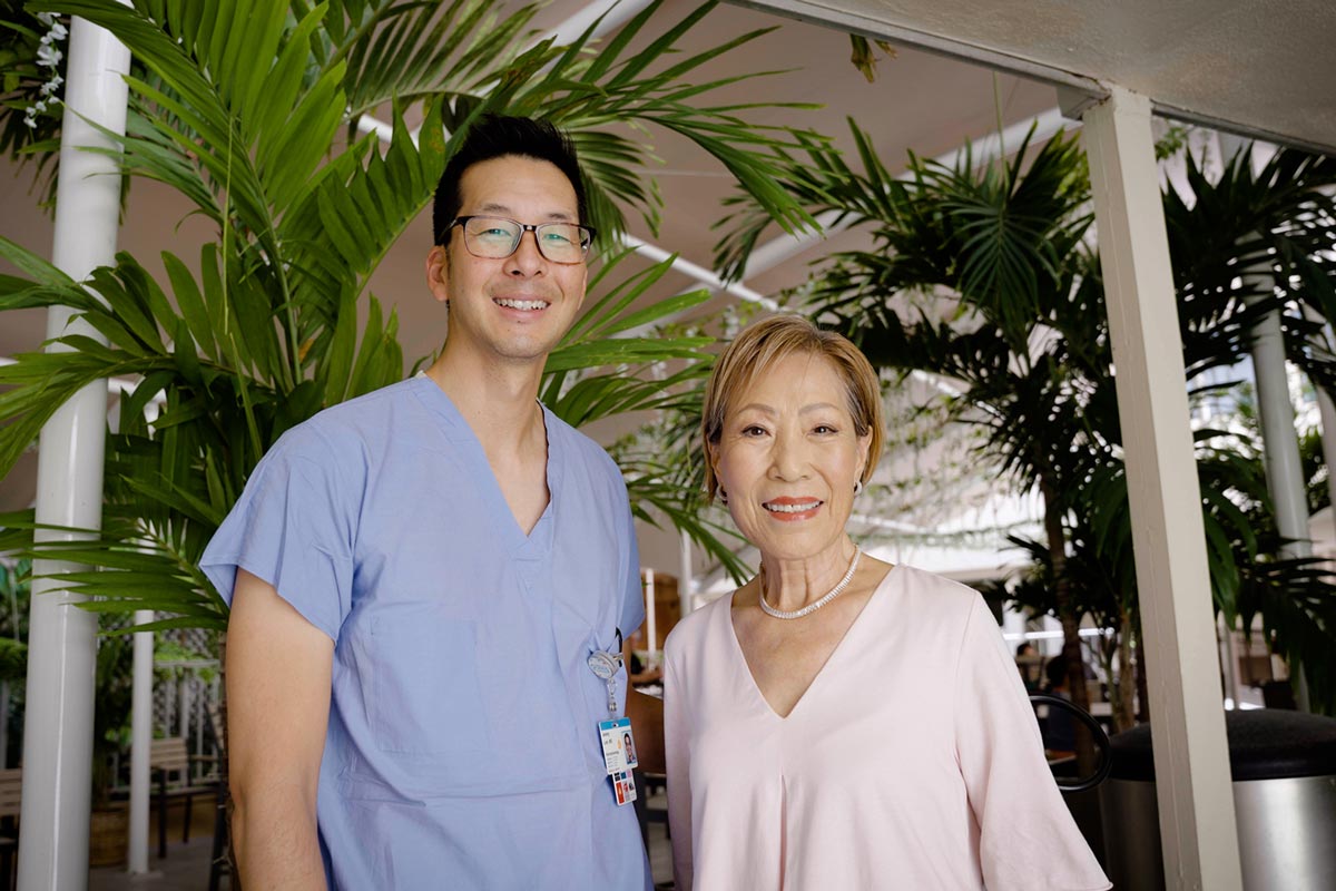 Dr. Jeremy Lum stands with Chung Lucky in the Rotunda at Straub Benioff Medical Center