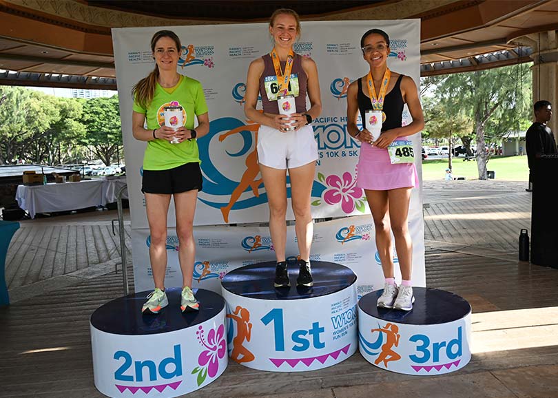 Three female race winners on first, second and third place podiums.