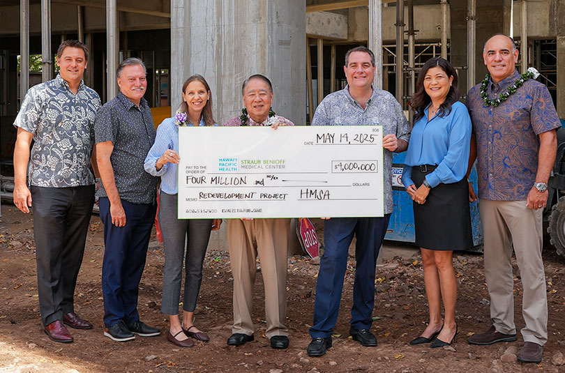 Group shot with giant check for $4 million.